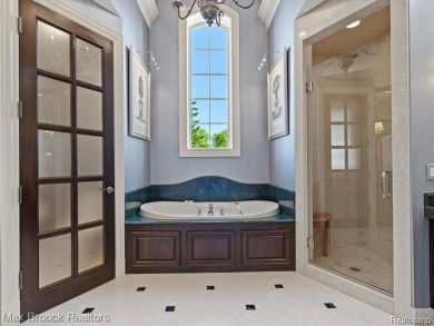 This exquisite French Country-inspired residence is situated on Forest Lake Country Club in Michigan - for sale on GolfHomes.com, golf home, golf lot