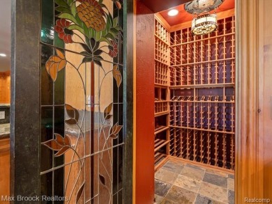 This exquisite French Country-inspired residence is situated on Forest Lake Country Club in Michigan - for sale on GolfHomes.com, golf home, golf lot