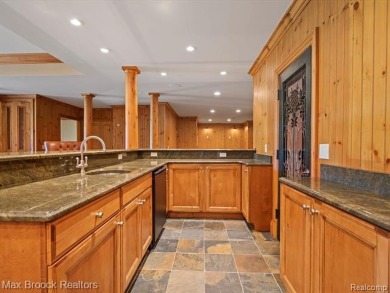 This exquisite French Country-inspired residence is situated on Forest Lake Country Club in Michigan - for sale on GolfHomes.com, golf home, golf lot