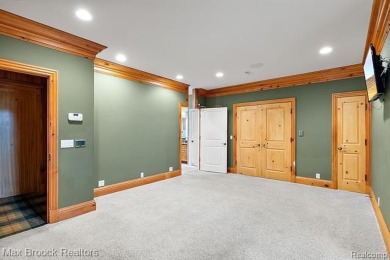 This exquisite French Country-inspired residence is situated on Forest Lake Country Club in Michigan - for sale on GolfHomes.com, golf home, golf lot