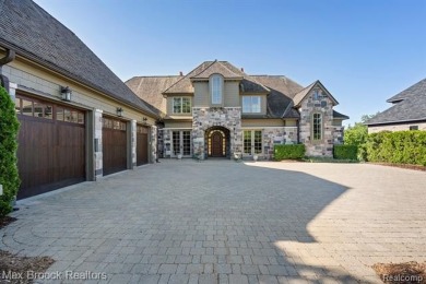 This exquisite French Country-inspired residence is situated on Forest Lake Country Club in Michigan - for sale on GolfHomes.com, golf home, golf lot