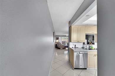 BEAUTIFUL 2 BEDROOM 2 BATH WITH MAGNIFICENT LAKE AND FOUNTAIN on Wynmoor Golf Course in Florida - for sale on GolfHomes.com, golf home, golf lot