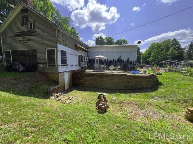 Welcome to 514 Main St in Alpha, Michigan--a unique property on George Young Golf Course in Michigan - for sale on GolfHomes.com, golf home, golf lot