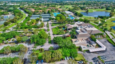 Located in the sought-after, gated community of The Glades at on Indian Spring Golf and Country Club in Florida - for sale on GolfHomes.com, golf home, golf lot