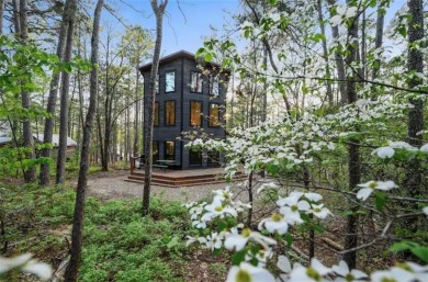 The Howling Wolf* is a towering getaway cabin with an amazing on Cedar Creek Golf Course At Beavers Bend State Park in Oklahoma - for sale on GolfHomes.com, golf home, golf lot