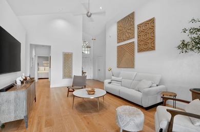 Discover refined single-story living in the prestigious Whisper on Broken Sound Golf and Club  in Florida - for sale on GolfHomes.com, golf home, golf lot