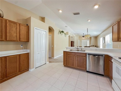 Welcome to this beautifully maintained 3-bedroom, 2-bathroom on Heritage Isles Golf and Country Club in Florida - for sale on GolfHomes.com, golf home, golf lot