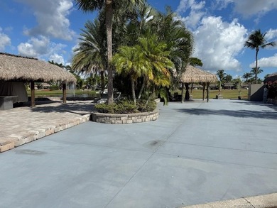 Prime Lakefront Lot on *Millionaire's Row* - Fully Furnished! on Motorcoach Resort Golf Course in Florida - for sale on GolfHomes.com, golf home, golf lot