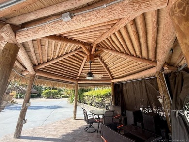 Prime Lakefront Lot on *Millionaire's Row* - Fully Furnished! on Motorcoach Resort Golf Course in Florida - for sale on GolfHomes.com, golf home, golf lot