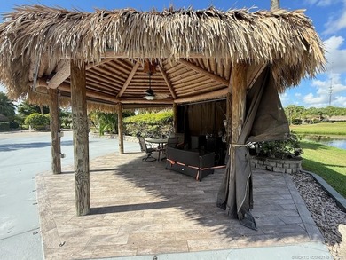 Prime Lakefront Lot on *Millionaire's Row* - Fully Furnished! on Motorcoach Resort Golf Course in Florida - for sale on GolfHomes.com, golf home, golf lot