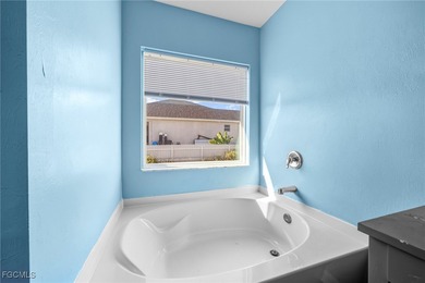 Modern 2017-Built Home in Lehigh Acres! Welcome to this on River Hall Country Club in Florida - for sale on GolfHomes.com, golf home, golf lot