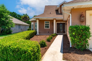 This immaculately maintained, custom-built home overlooks the on Shalimar Pointe Golf and Country Club in Florida - for sale on GolfHomes.com, golf home, golf lot