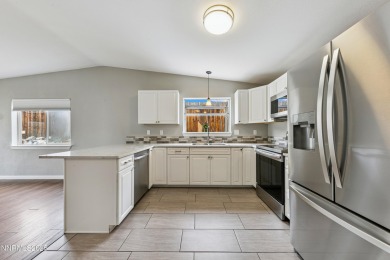 This three-bedroom, two-bath home spans 1,259 square feet and is on Sun Ridge Golf Course in Nevada - for sale on GolfHomes.com, golf home, golf lot