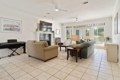 This immaculately maintained, custom-built home overlooks the on Shalimar Pointe Golf and Country Club in Florida - for sale on GolfHomes.com, golf home, golf lot