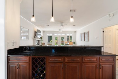 This immaculately maintained, custom-built home overlooks the on Shalimar Pointe Golf and Country Club in Florida - for sale on GolfHomes.com, golf home, golf lot