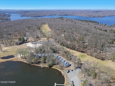 Unbeatable location nestled directly between the tranquil shores on Paupack Hills Golf and Country Club in Pennsylvania - for sale on GolfHomes.com, golf home, golf lot