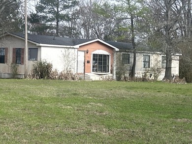 Discover the potential of this 3.17-acre property tucked away on Rocky Branch Golf Club in Georgia - for sale on GolfHomes.com, golf home, golf lot