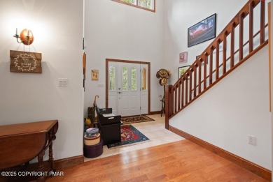 This stunning 3,000 plus square foot house in gated Timber on Lake Naomi Timber Trails Golf Club in Pennsylvania - for sale on GolfHomes.com, golf home, golf lot