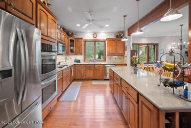 This stunning 3,000 plus square foot house in gated Timber on Lake Naomi Timber Trails Golf Club in Pennsylvania - for sale on GolfHomes.com, golf home, golf lot