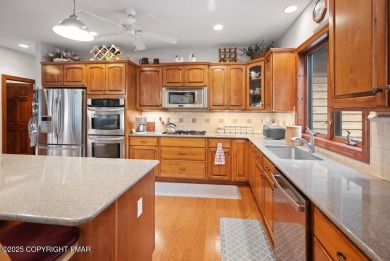 This stunning 3,000 plus square foot house in gated Timber on Lake Naomi Timber Trails Golf Club in Pennsylvania - for sale on GolfHomes.com, golf home, golf lot