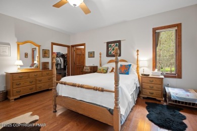 This stunning 3,000 plus square foot house in gated Timber on Lake Naomi Timber Trails Golf Club in Pennsylvania - for sale on GolfHomes.com, golf home, golf lot