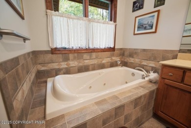 This stunning 3,000 plus square foot house in gated Timber on Lake Naomi Timber Trails Golf Club in Pennsylvania - for sale on GolfHomes.com, golf home, golf lot