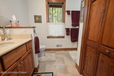 This stunning 3,000 plus square foot house in gated Timber on Lake Naomi Timber Trails Golf Club in Pennsylvania - for sale on GolfHomes.com, golf home, golf lot