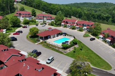 Discover your dream ski getaway in this 2-story, end-unit on Crystal Mountain Golf Course in Michigan - for sale on GolfHomes.com, golf home, golf lot