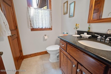 This stunning 3,000 plus square foot house in gated Timber on Lake Naomi Timber Trails Golf Club in Pennsylvania - for sale on GolfHomes.com, golf home, golf lot
