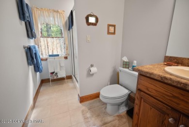 This stunning 3,000 plus square foot house in gated Timber on Lake Naomi Timber Trails Golf Club in Pennsylvania - for sale on GolfHomes.com, golf home, golf lot