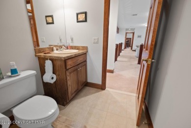 This stunning 3,000 plus square foot house in gated Timber on Lake Naomi Timber Trails Golf Club in Pennsylvania - for sale on GolfHomes.com, golf home, golf lot