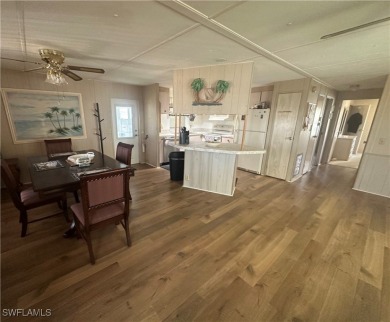 Enjoy a home and your own golf cart in the active 55+ community on Sabal Trace Golf and Country Club in Florida - for sale on GolfHomes.com, golf home, golf lot