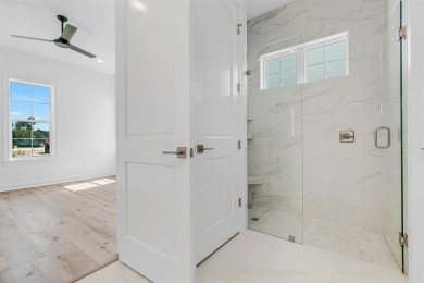 Discover refined coastal living in this thoughtfully designed on Origins Golf Club in Florida - for sale on GolfHomes.com, golf home, golf lot