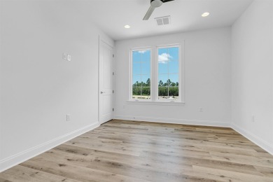 Discover refined coastal living in this thoughtfully designed on Origins Golf Club in Florida - for sale on GolfHomes.com, golf home, golf lot
