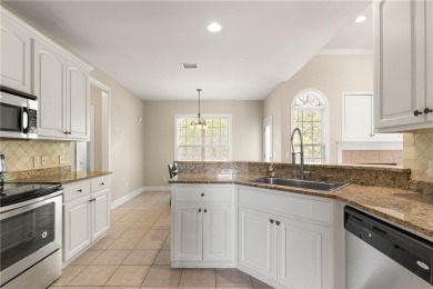 Discover this stunning traditional-style home located in the on Oak Grove Island Golf and Country Club in Georgia - for sale on GolfHomes.com, golf home, golf lot