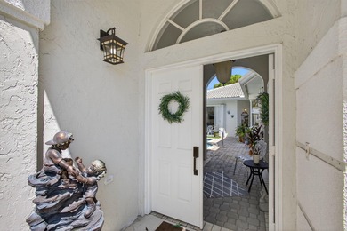 Rarely available single-story courtyard home perfectly situated on The President Country Club in Florida - for sale on GolfHomes.com, golf home, golf lot