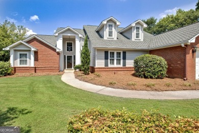 This bright, sunlit gem is situated overlooking a beautiful lake on Braelinn Golf Club in Georgia - for sale on GolfHomes.com, golf home, golf lot