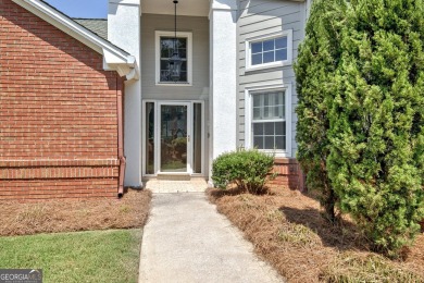This bright, sunlit gem is situated overlooking a beautiful lake on Braelinn Golf Club in Georgia - for sale on GolfHomes.com, golf home, golf lot