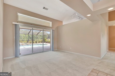 This bright, sunlit gem is situated overlooking a beautiful lake on Braelinn Golf Club in Georgia - for sale on GolfHomes.com, golf home, golf lot