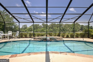 This bright, sunlit gem is situated overlooking a beautiful lake on Braelinn Golf Club in Georgia - for sale on GolfHomes.com, golf home, golf lot