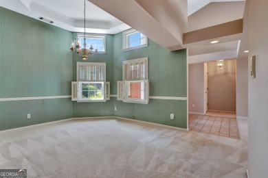 This bright, sunlit gem is situated overlooking a beautiful lake on Braelinn Golf Club in Georgia - for sale on GolfHomes.com, golf home, golf lot
