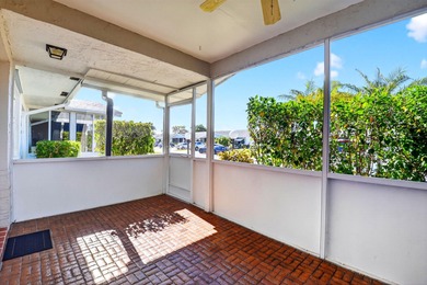 Experience stress-free, easy living in the gated Cypress Lakes on Cypress Lakes Golf Course - West Palm Beach in Florida - for sale on GolfHomes.com, golf home, golf lot