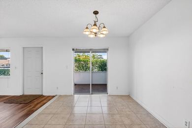 Experience stress-free, easy living in the gated Cypress Lakes on Cypress Lakes Golf Course - West Palm Beach in Florida - for sale on GolfHomes.com, golf home, golf lot