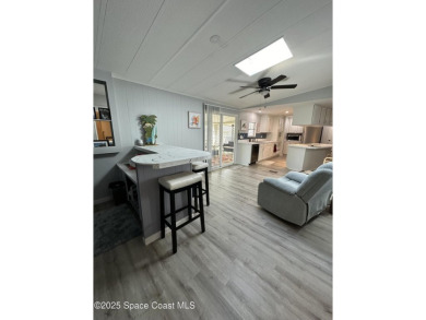 This property boasts numerous desirable features. New Roof 2023 on Barefoot Bay Golf Course in Florida - for sale on GolfHomes.com, golf home, golf lot