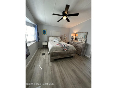 This property boasts numerous desirable features. New Roof 2023 on Barefoot Bay Golf Course in Florida - for sale on GolfHomes.com, golf home, golf lot