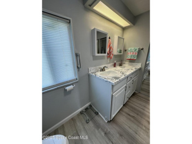 This property boasts numerous desirable features. New Roof 2023 on Barefoot Bay Golf Course in Florida - for sale on GolfHomes.com, golf home, golf lot