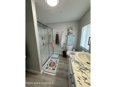This property boasts numerous desirable features. New Roof 2023 on Barefoot Bay Golf Course in Florida - for sale on GolfHomes.com, golf home, golf lot
