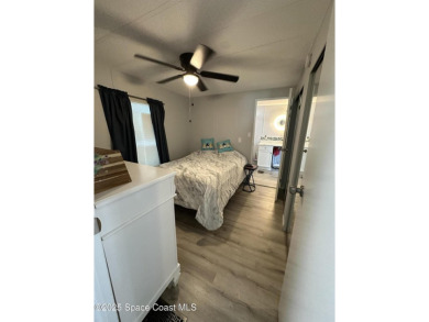 This property boasts numerous desirable features. New Roof 2023 on Barefoot Bay Golf Course in Florida - for sale on GolfHomes.com, golf home, golf lot