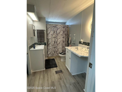 This property boasts numerous desirable features. New Roof 2023 on Barefoot Bay Golf Course in Florida - for sale on GolfHomes.com, golf home, golf lot