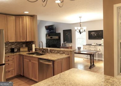 Step into this beautifully maintained home that welcomes you on Fairfield Plantation Golf and Country Club in Georgia - for sale on GolfHomes.com, golf home, golf lot